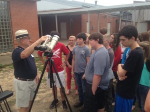 Ken keeps the students busy until the clouds break.