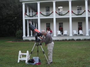 Dean in front of the Wesley house all decorated for the holidays.