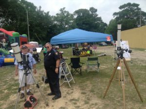 A local Constable examines Dennis' equipment.